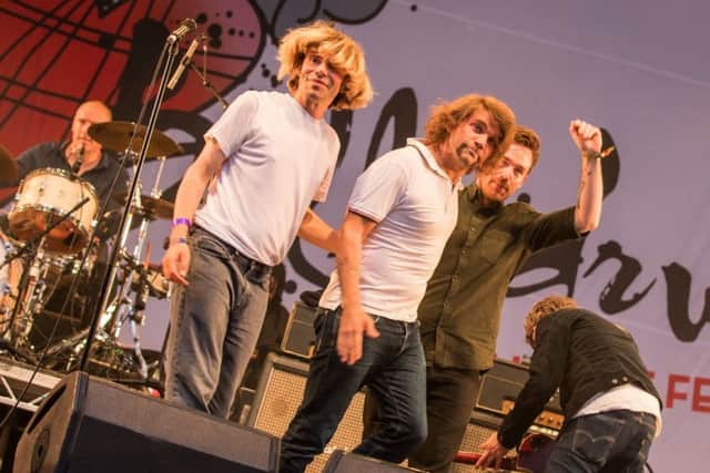 Frightened Rabbit band members Grant Hutchison and keyboard player Billy Kennedy join Tim Burgess and the Charlatans on stage at Belladrum. Photo: Paul Campbell.