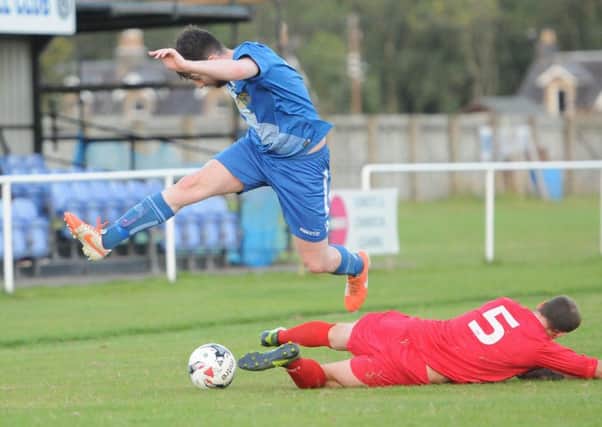 Ryan Ward jumps a tackle for Selkirk (picture by Grant Kinghorn).