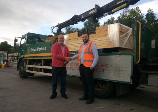 Bob Campbell from the shed takes delivery from Oliver Axford of Travis Perkins