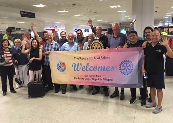 A group of 26 Rotarians from Naga City in the Philippines arrived in the Borders to meet up with their twin club  the Rotary Club of Selkirk. The picture shows Selkirk Rotarians, with a welcome banner, meeting their Naga City guests at Edinburgh airport.