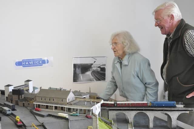 Rail campaigners Madge Elliot and Robin Deas, with a replica model of Hawick's old railway station, made by Mr Deas.