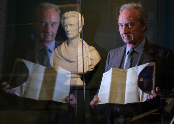 The Duke of Buccleuch admires the new Victoria exhibition which opens at Bowhill House this weekend.