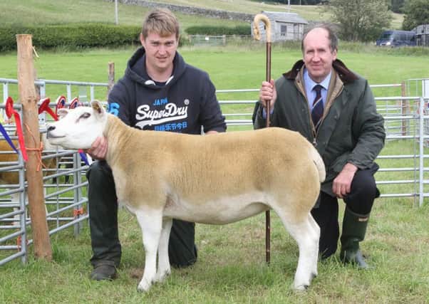 Champion sheep of the show went to Glen Wilson from Hawthornside Farm, Bonchester Bridge, with his Texel one crop ewe, pictured with show chairman David Anderson.