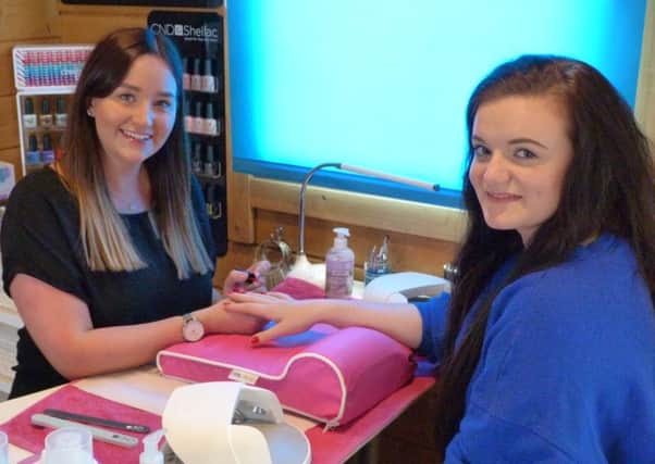 Beauty therapists Alice Mackay and client Amy Thomson.
