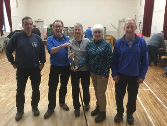 Keith Robeson, senior countryside ranger; Alistair Pattullo and Barbara Richardson from Selkirk and Ettrick/Yarrow, Marion Short, chair of Hawick Walking Festival Group, and Iain Crozier, vice chair, with the The ceremonial hand-over of the walking stick.