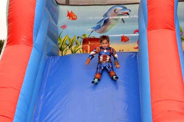 Captain America makes a personal appearance on the bouncy slide.