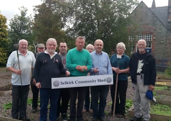 Members of Selkirk Community Shed in their garden.