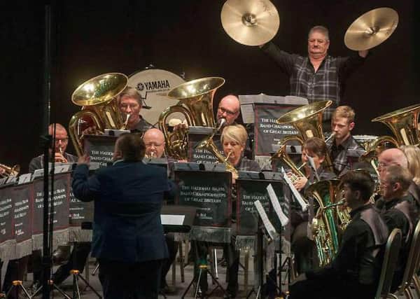 Percussionist Graham Borthwick crashes the cymbals to spectacular effect during Selkirk Silver Bands top-drawer display at Sundays National Brass Band Championships of Great Britain in Cheltenham.  (Photo: British Bandsman Magazine).
