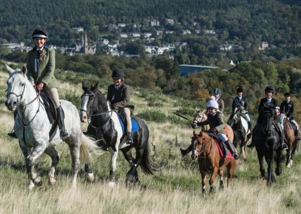 Members of the Peebles March Riders Association ride up Morning Hill.  Photo: Gareth Easton