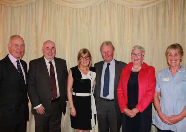 From left: Jack Clark, auctioneer; Jim Robertson, after dinner speaker; organisers Elaine and James Marjoribanks; and Maureen Stevenson and Judy Lever, representing Marie Curie.