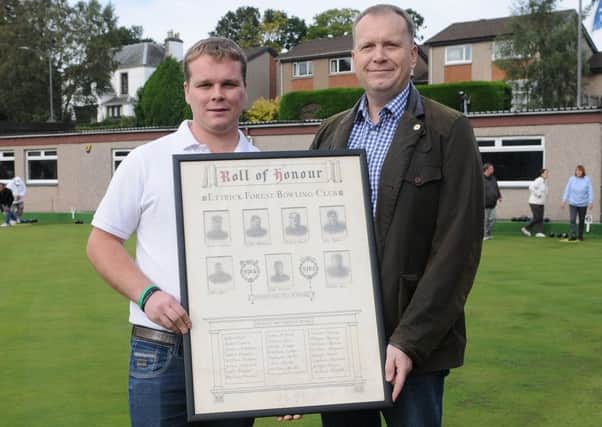 David Deacon, right,  presents the First World War roll of honour to Greg Sandilands, president of Ettrick Forrest Bowling Club, as part of the Selkirk Remembers project.
