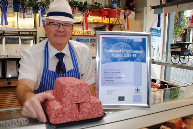 Allan Learmonth, from Learmonth's Butchers in Jedburgh, with his award-winning flat sausage.