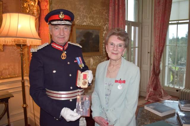 Eilean Hogarth is awarded the British Empire Medal by the Duke of Buccleuch.