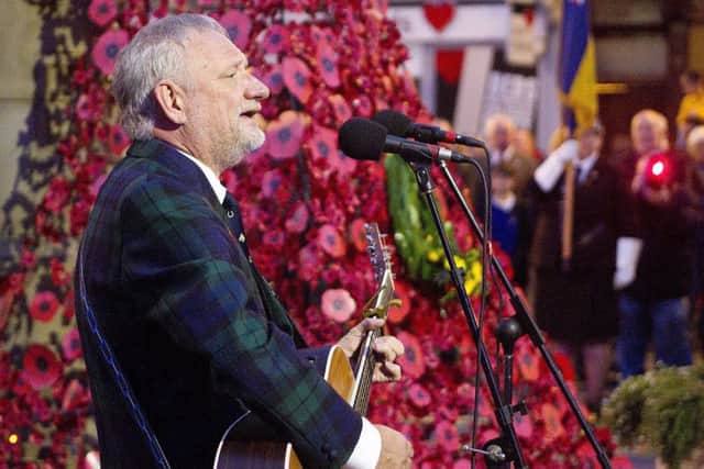Hawick singer songerwriter Alan Brydon performs during the ceremony.