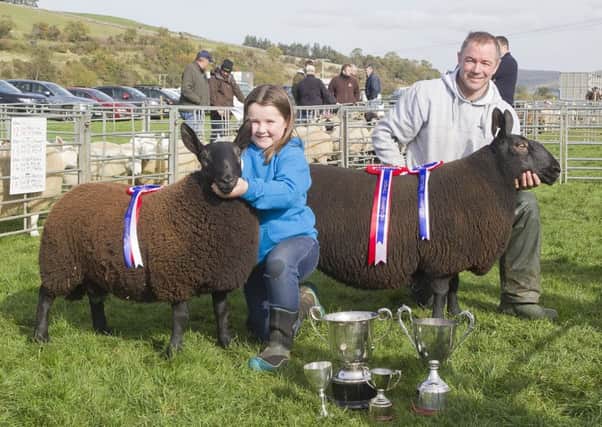 Young handler champion Kirsty Turnbull with Steven, from Jedburgh, and his overall champion Cheviot.