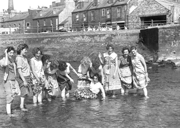 Archive photo of ladies paddling in the river Teviot, Hawick.