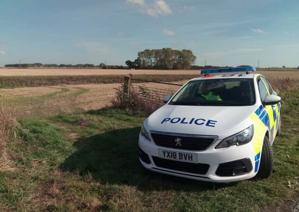 Police near the scene of the aeroplane crash in East Yorkshire.