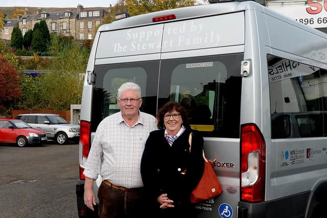 Benefactor Alan Stewart with the new bus named after his father, and executive officer of the Bridge, Morag Walker.