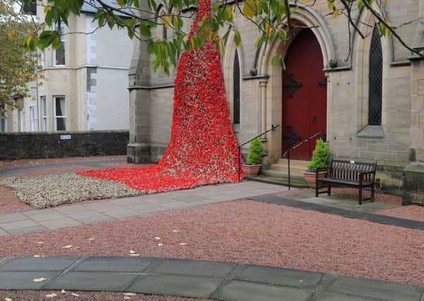 The Poppy Cascade on Selkirk Parish Church features thousands of knitted poppies.