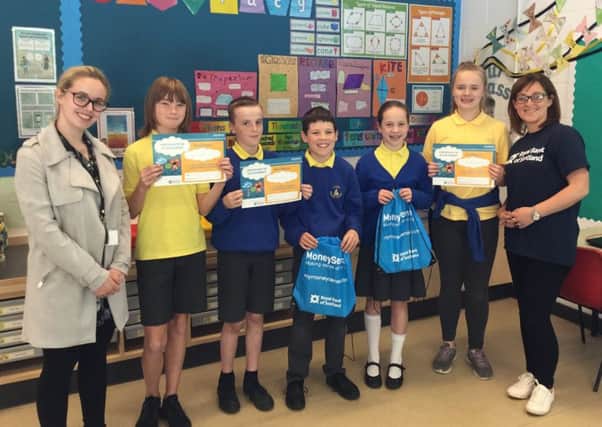 Borders school pupils have been learning about managing money during numeracy week with help from the Royal Bank of Scotland (RBS).
Lauder Primary in yellow t-shirts with Imogen Heard from DYW (developing young workforce)