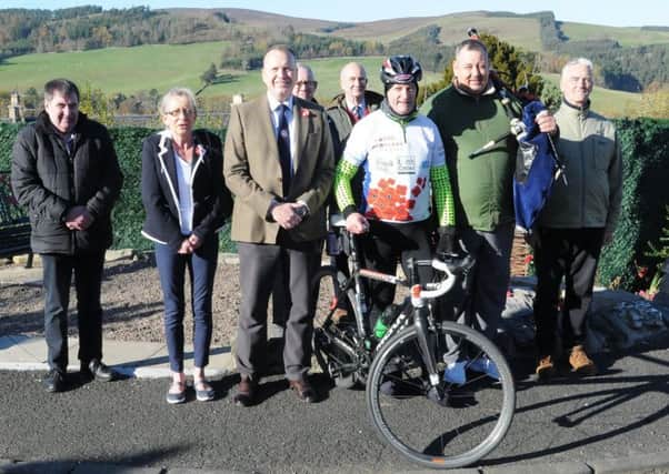 Hawick RBLS branch chairman Ian McLeod with David Deacon, piper Kev Turnbull  and supporters from both Hawick and Selkirk at Selkirk war memorial during his 1,918 cycle.