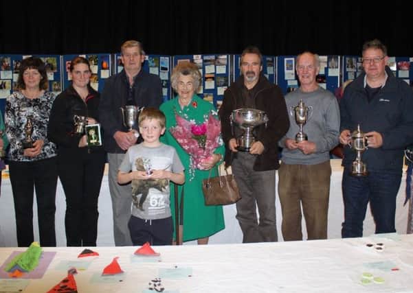 Some of the winners from last Saturdays Kelso Horticultural  Society autumn show display the silverware their efforts earned them.