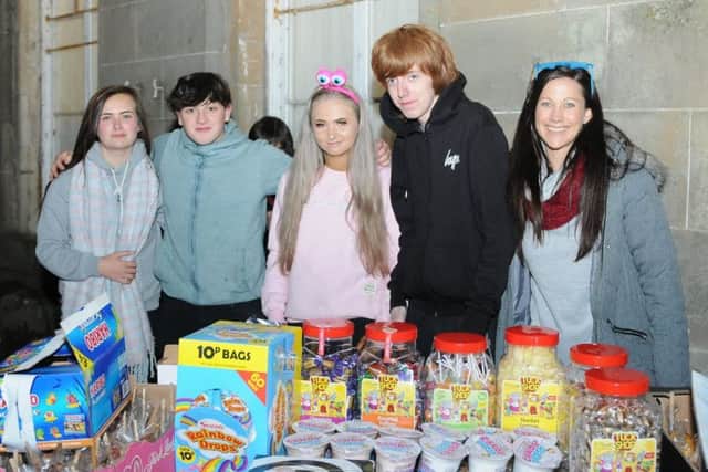 Kids from Rowlands man the sweet stall at the Haining.