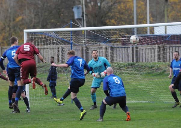 Oakley, in red, put pressure on the Hawick goal in the first half (picture by Grant Kinghorn)