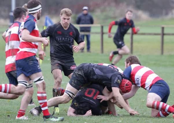Peebles, in their red and white stripes, ended Biggar's perfect winning record with a 7-10 win (picture by Nigel Pacey)