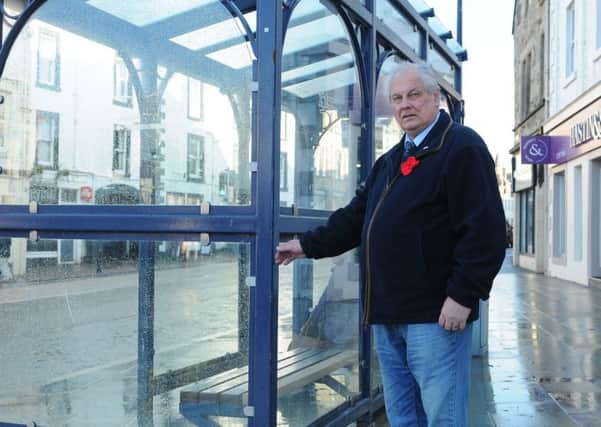 Selkirkshire councillor Gordon Edgar at the bus shelter in Selkirk's Market Place.