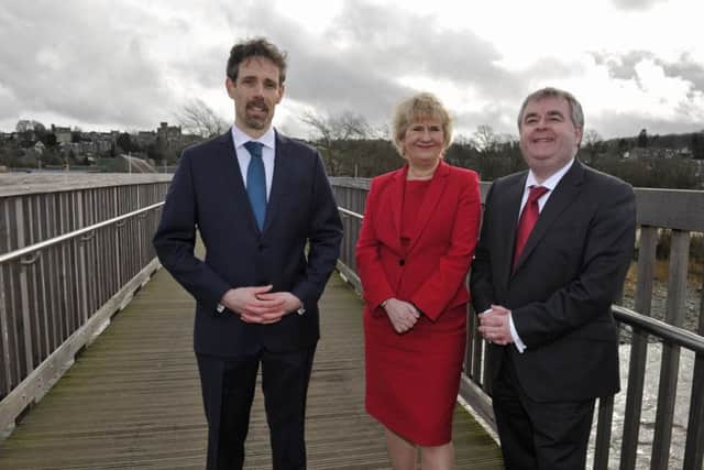 Selkirk's flood defences being officially unveiled in February 2017.
Selkirk FPS project manager Conor Price, Cabinet Secretary for Environment, Climate Change and Land Reform, Roseanna Cunningham and SBC leader Councillor David Parker on the Bridge Street footbridge.