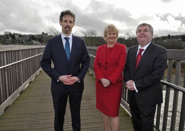 Selkirk's flood defences being officially unveiled in February 2017.
Selkirk FPS project manager Conor Price, Cabinet Secretary for Environment, Climate Change and Land Reform, Roseanna Cunningham and SBC leader Councillor David Parker on the Bridge Street footbridge.