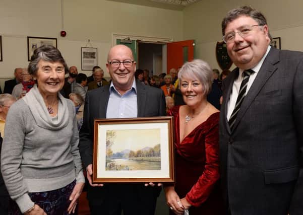 Former Melrose post master John Collins received a retirment gift from the Melrose Community. John is pictured with his wife Sandra, left, and community councillors Val Miller and William Windrum.