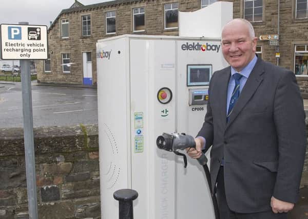 Watson McAteer at the Common Haugh car park's electric vehicle-charging point.