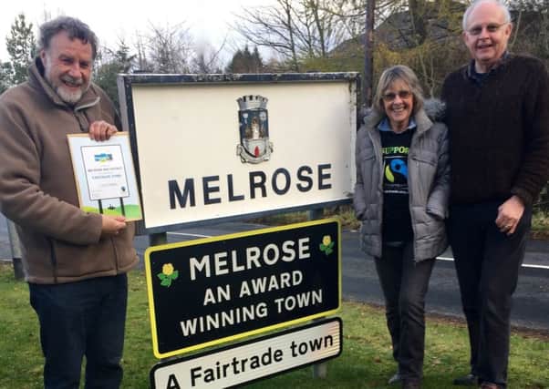 From left, David Potts (with the Fairtrade Town renewed status certificate), and Jenni and Leslie Young.