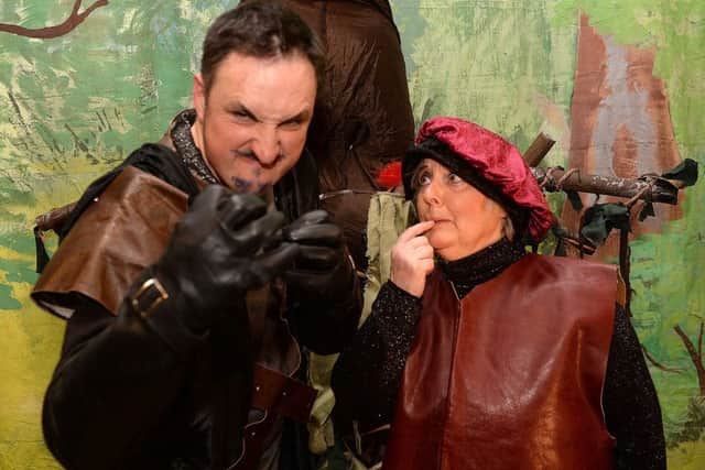 The Sheriff and Dennis (Gregor Hall and Aileen Collings) cook up a dastardly plan.