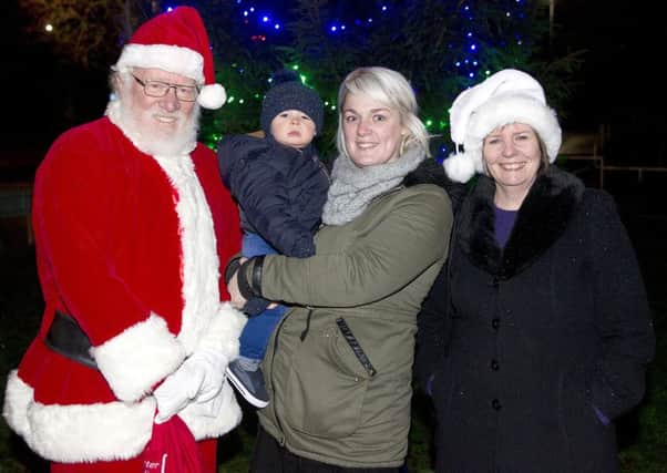 Lewis and Sarah Marshall get to meet Santa at St Boswells with Fiona Duplessis (Mrs Claus).