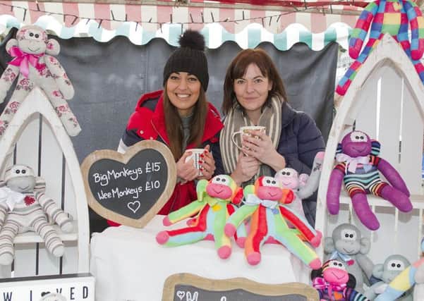Hollie Robson helping Louise Young at her Sock Monkey Stall