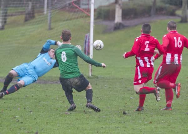 Tweeddale Rovers, in red and white, take on Greenlaw (picture by Bill McBurnie).