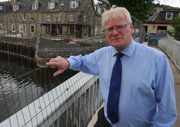 Councillor Stuart Marshall overlooking the River Teviot in Hawick.