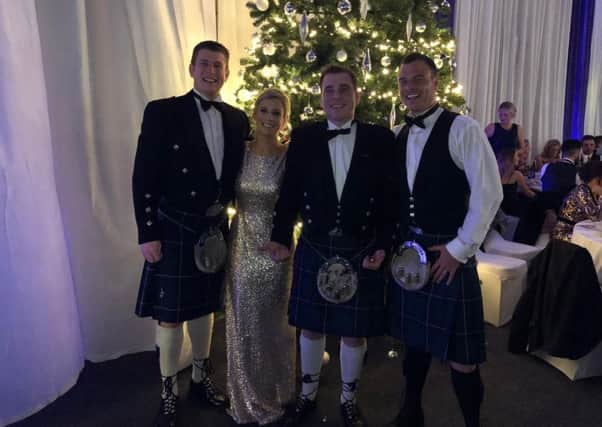Leanne Monaghan, organiser of the Advent Ball in Kelso, with her brothers, Allan, Stephen and Michael.
