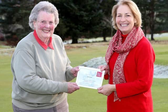 Helene Mauchline, (R) National Manager for The British Horse Society Scotland presents an Award to Ann Fraser for forty years long service as a Brtiish Horse Society volunteer.