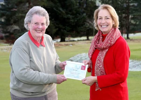 Helene Mauchline, (R) National Manager for The British Horse Society Scotland  presents an Award to Ann Fraser for forty years long service as a Brtiish Horse Society volunteer.