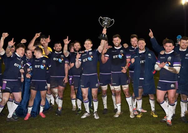 Scotland's Club players celebrate with the Dalriada Cup at Netherdale following their success in the last competition.