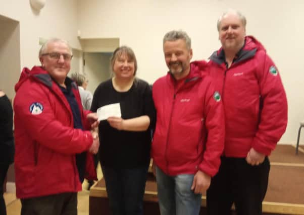 Border Search And Rescue Unit (BSARU) received almost Â£500 as a result of Heiton community library cafes Christmas lunch.
Rescue team leader Bob Mckeand, chairman Brian Tyson and treasurer Kevin Sterrick attended the village hall event when they were presented with a cheque by Gill Harrop, of Heiton village hall.