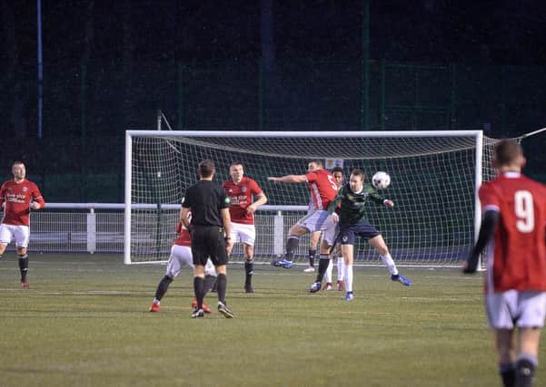 Gala FR's Ricky Miller, number five, helps to clear the ball away from his side's goalmouth (picture by Alwyn Johnston).