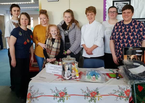 Mary Andersons daughter Clare and granddaughters Heather and Hayley with school kitchen staff at this years fair.