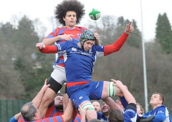 Air apparent - Penicuik narrowly steal a lineout from blue-clad Hawick Linden (picture by Bill McBurnie).
