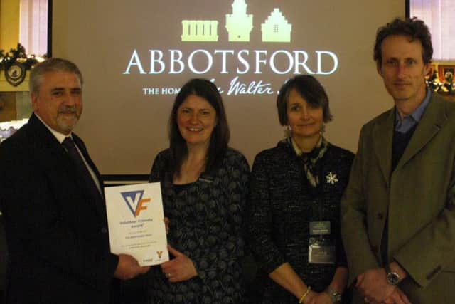 The Abbotsford team being given a Volunteer Friendly Award from Brian Lawson, senior policy and development officer at Volunteer Centre Borders. Pictured are, from left, Sandra Mackenzie, heritage engagement manager; Claudia Bolling, volunteer co-ordinator; and Giles Ingram, chief executive.