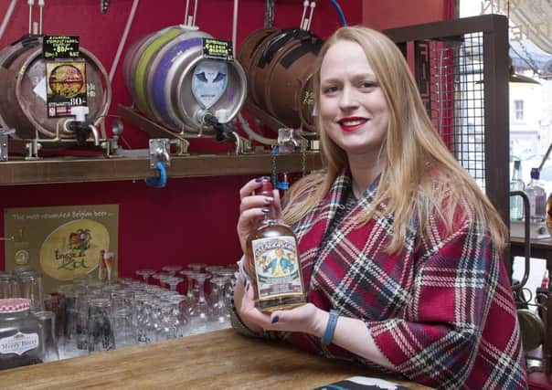 Audrey Anderson with their new haggis gin.